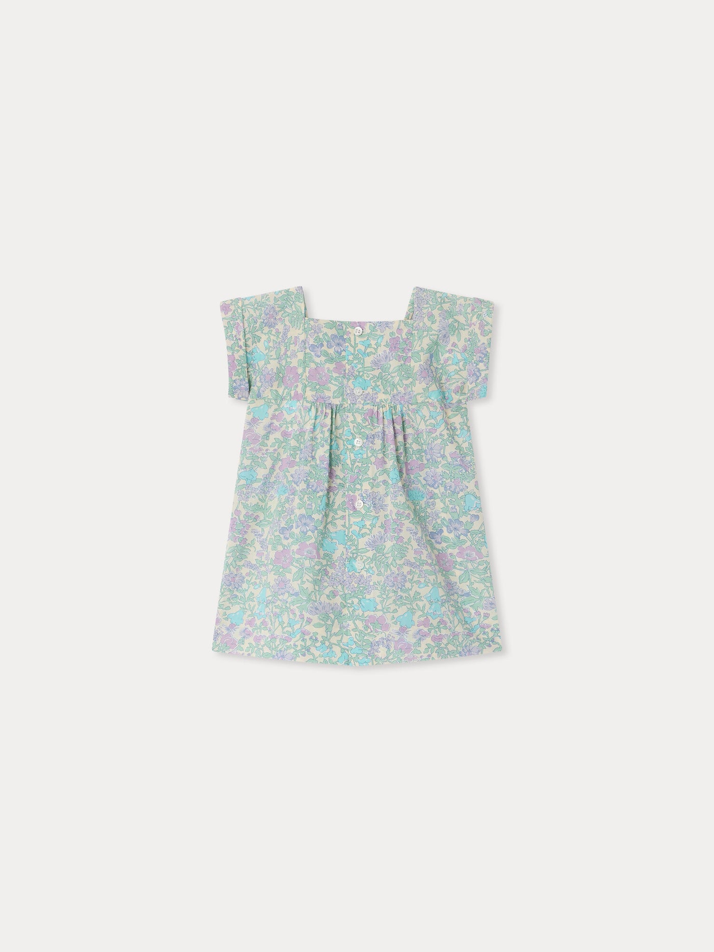 Smocked and hand-embroidered Pais dress in Liberty organic cotton fabric