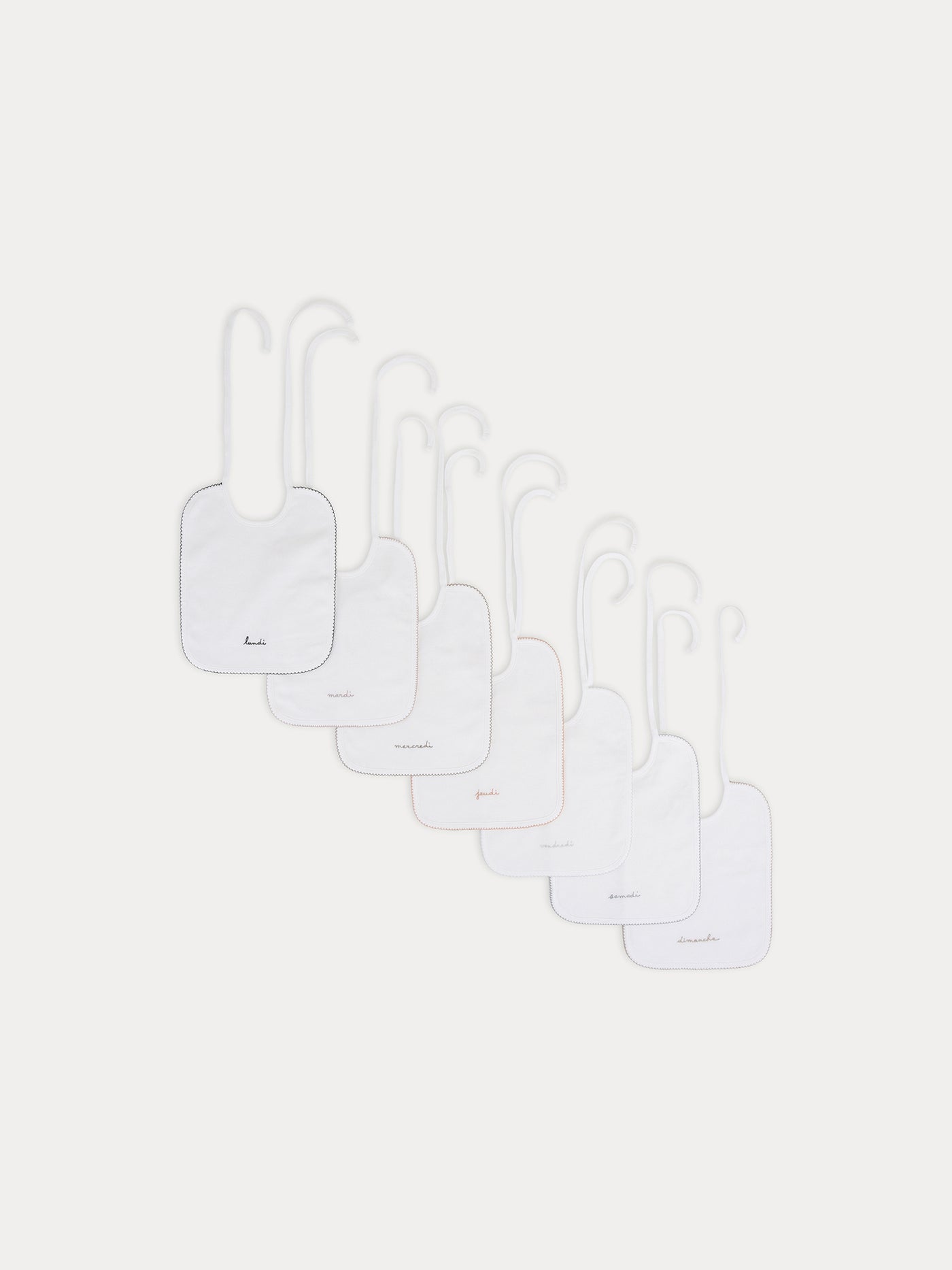 Set of embroidered bibs White