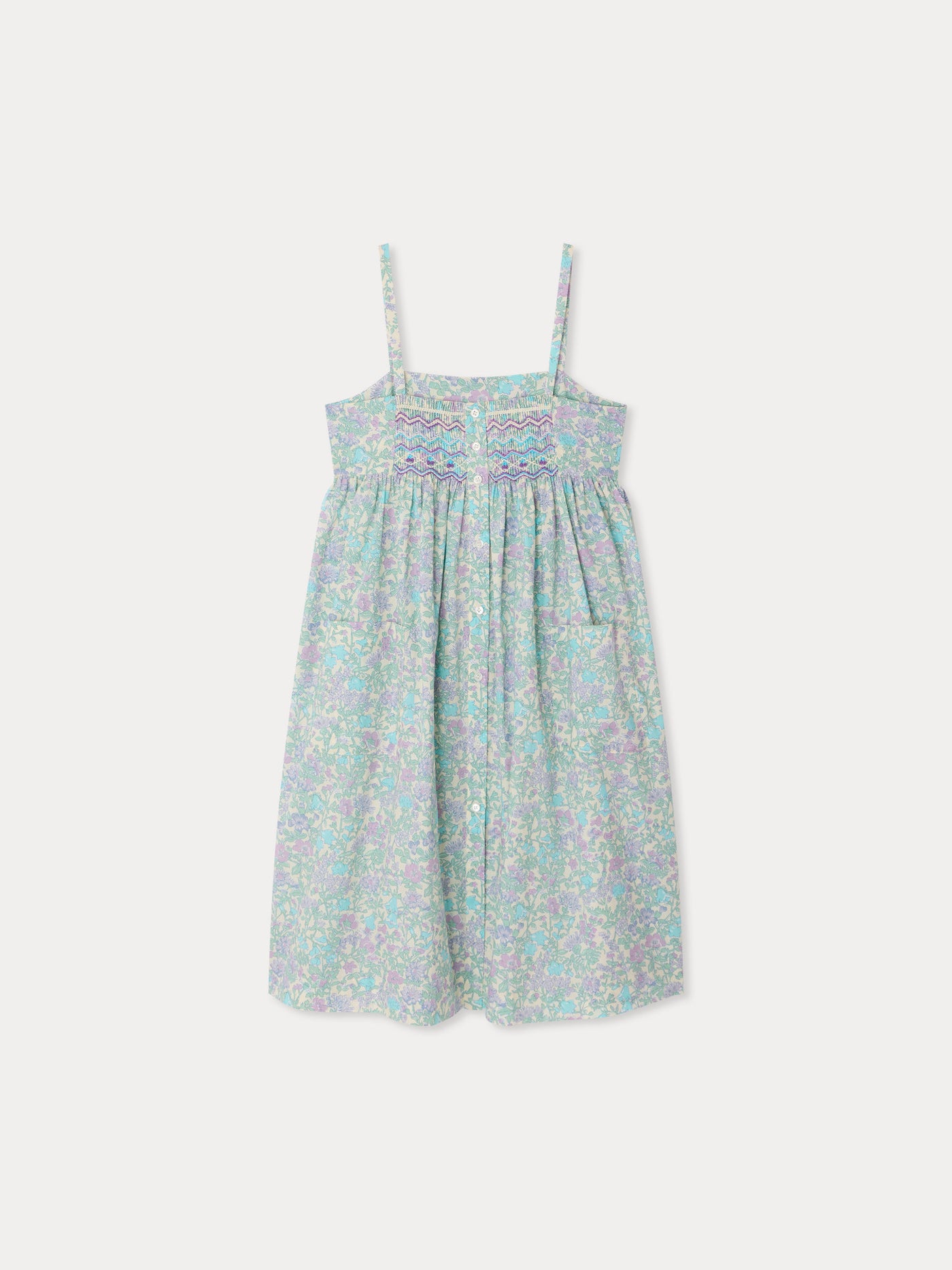 Passion dress smocked and embroidered in Liberty fabric in organic cotton