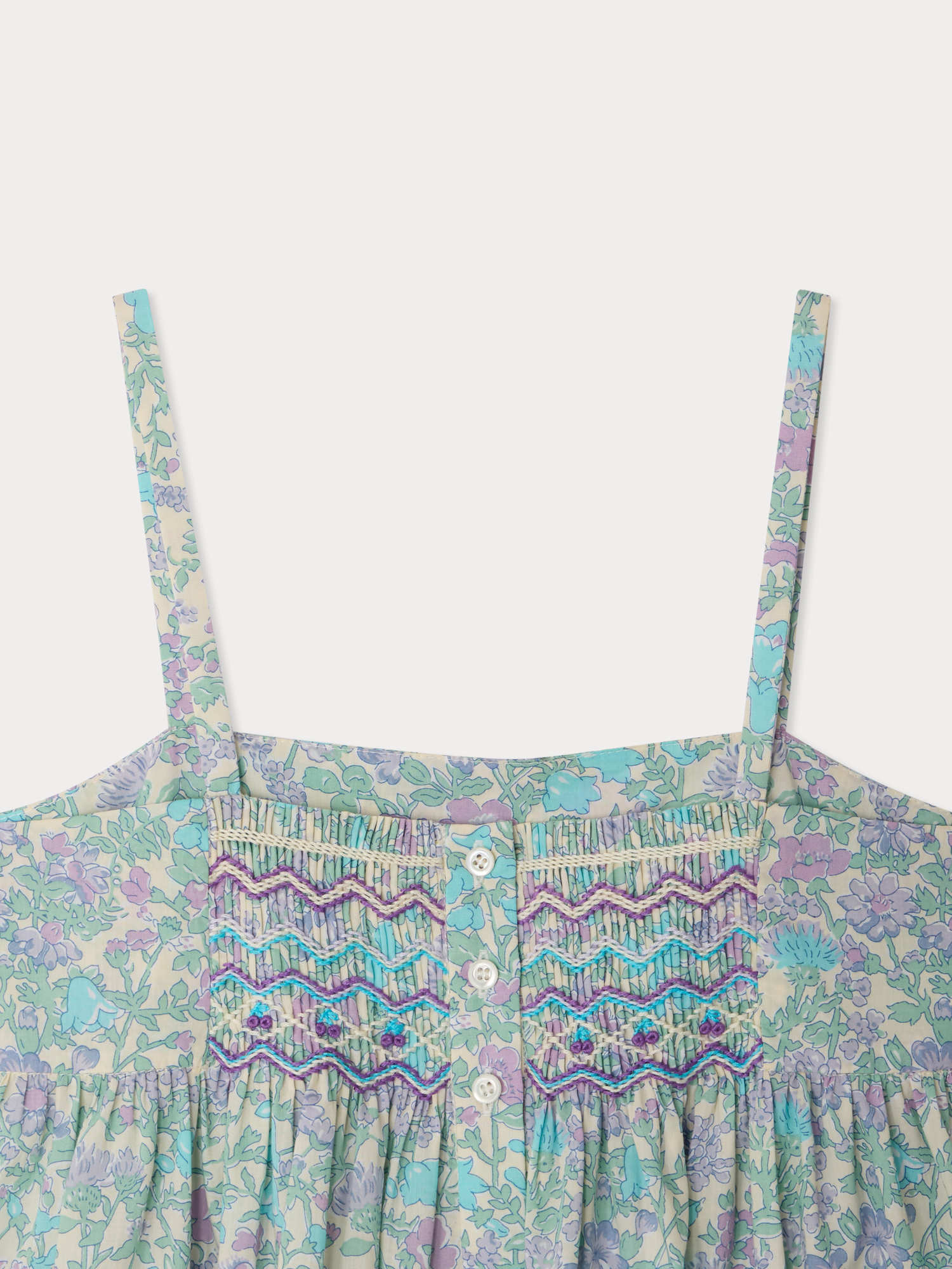 Passion dress smocked and embroidered in Liberty fabric in organic