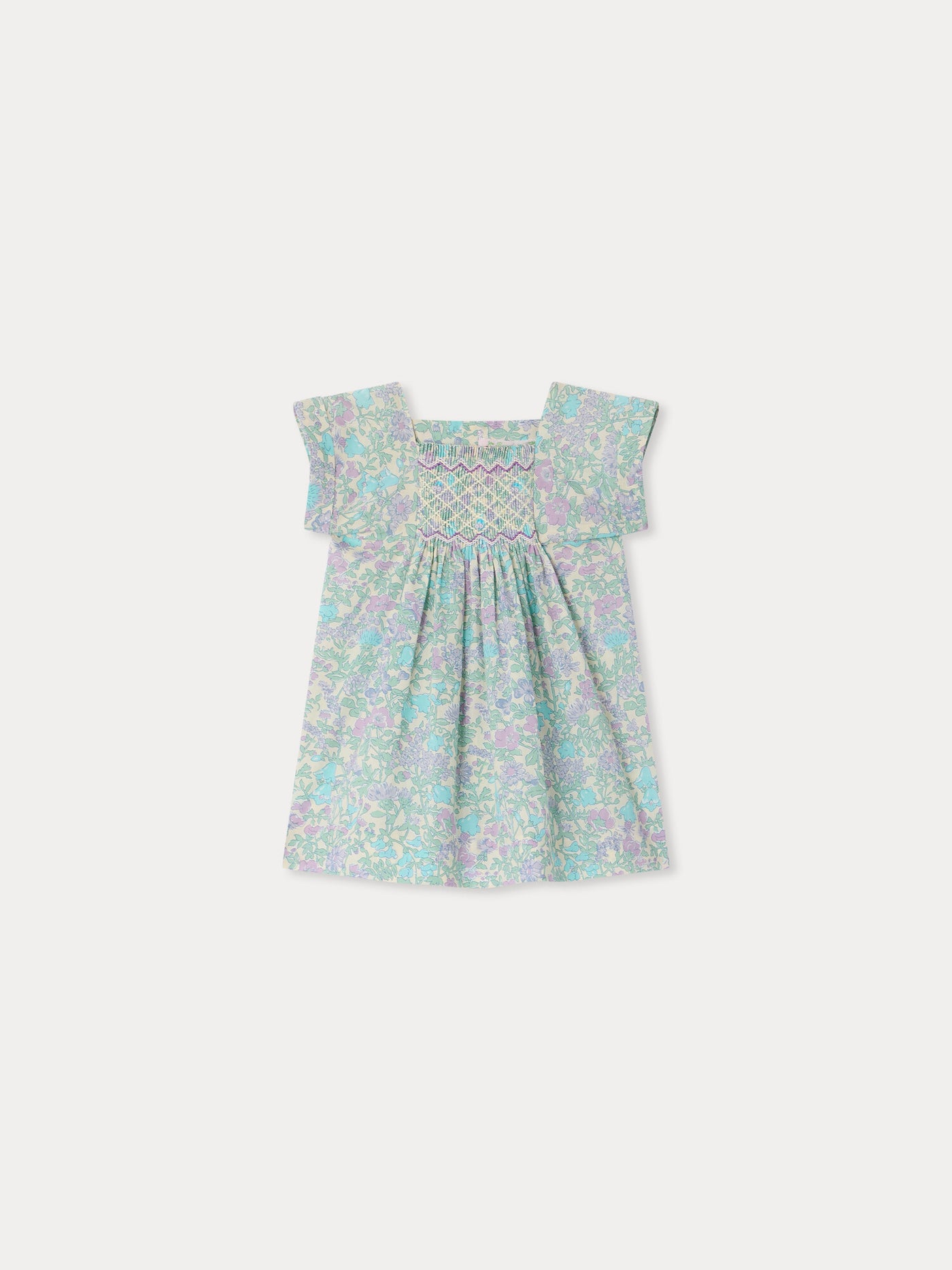 Smocked and hand-embroidered Pais dress in Liberty organic cotton fabric