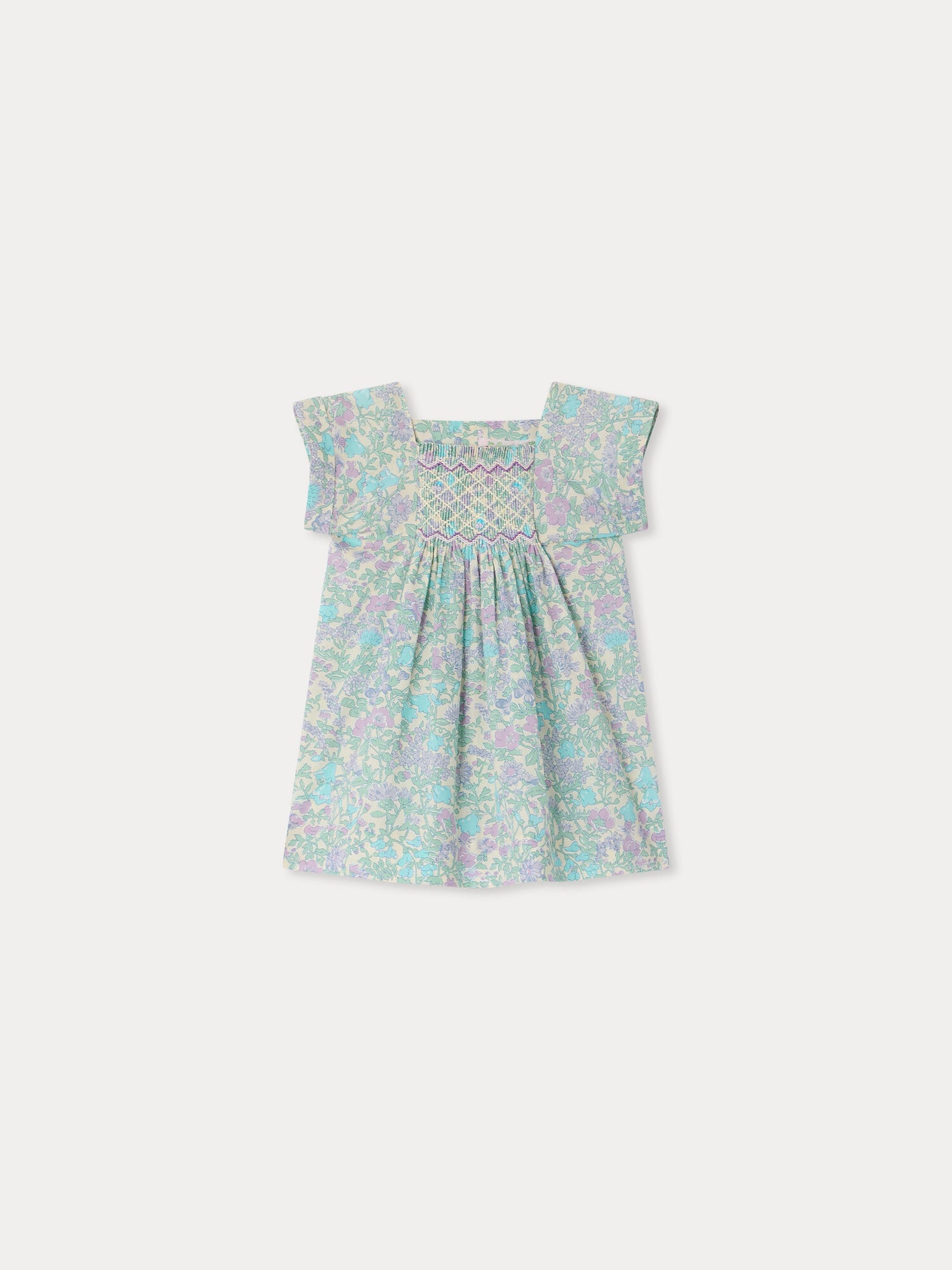 Smocked and hand-embroidered Pais dress in Liberty organic cotton fabric
