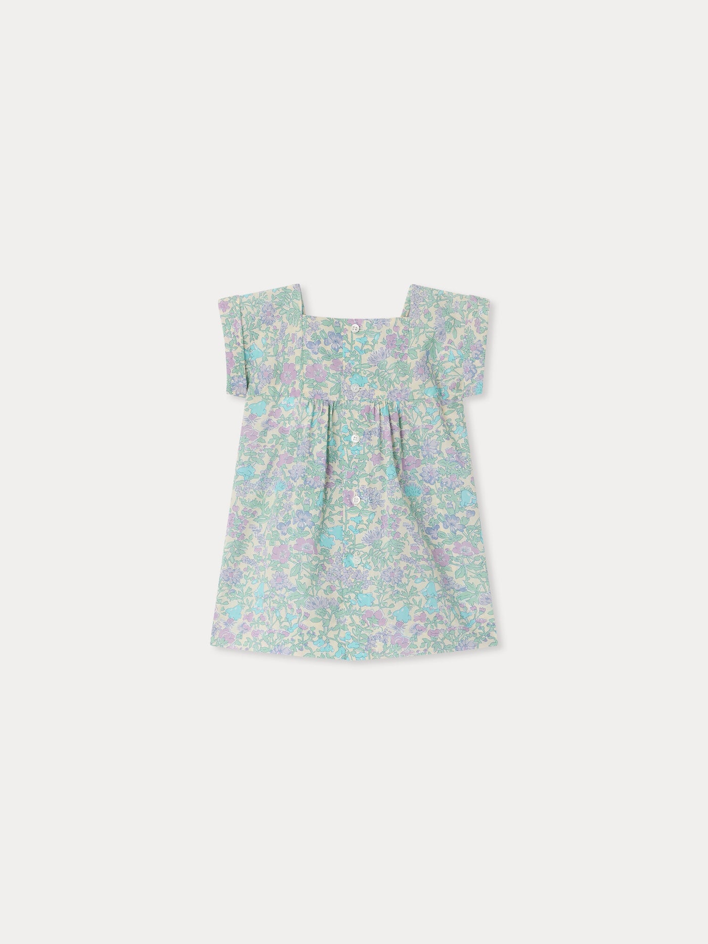 Smocked and hand-embroidered Pais dress in Liberty organic cotton fabric