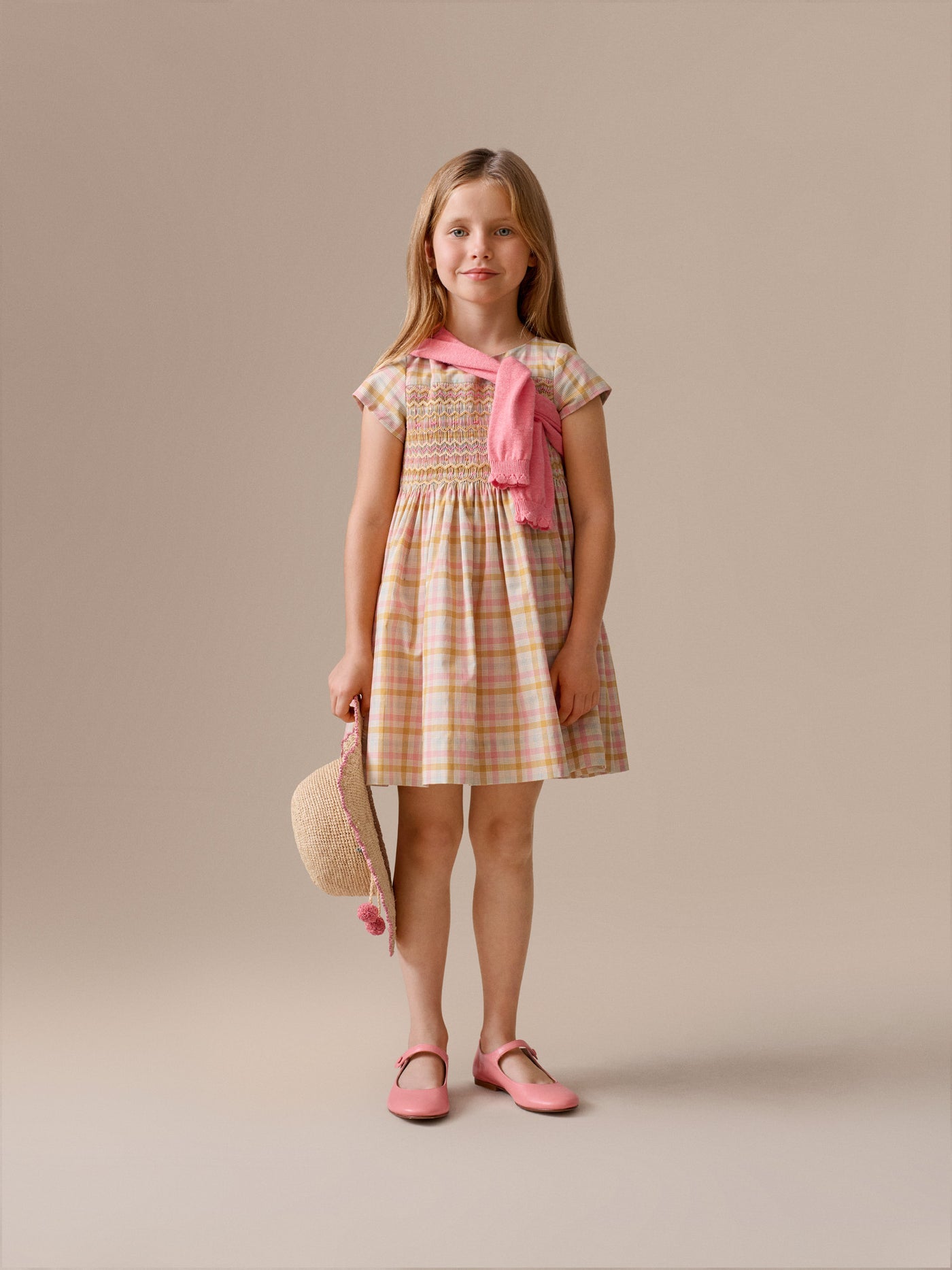 Duchesse dress in a smocked hand-embroidered check pattern in organic cotton