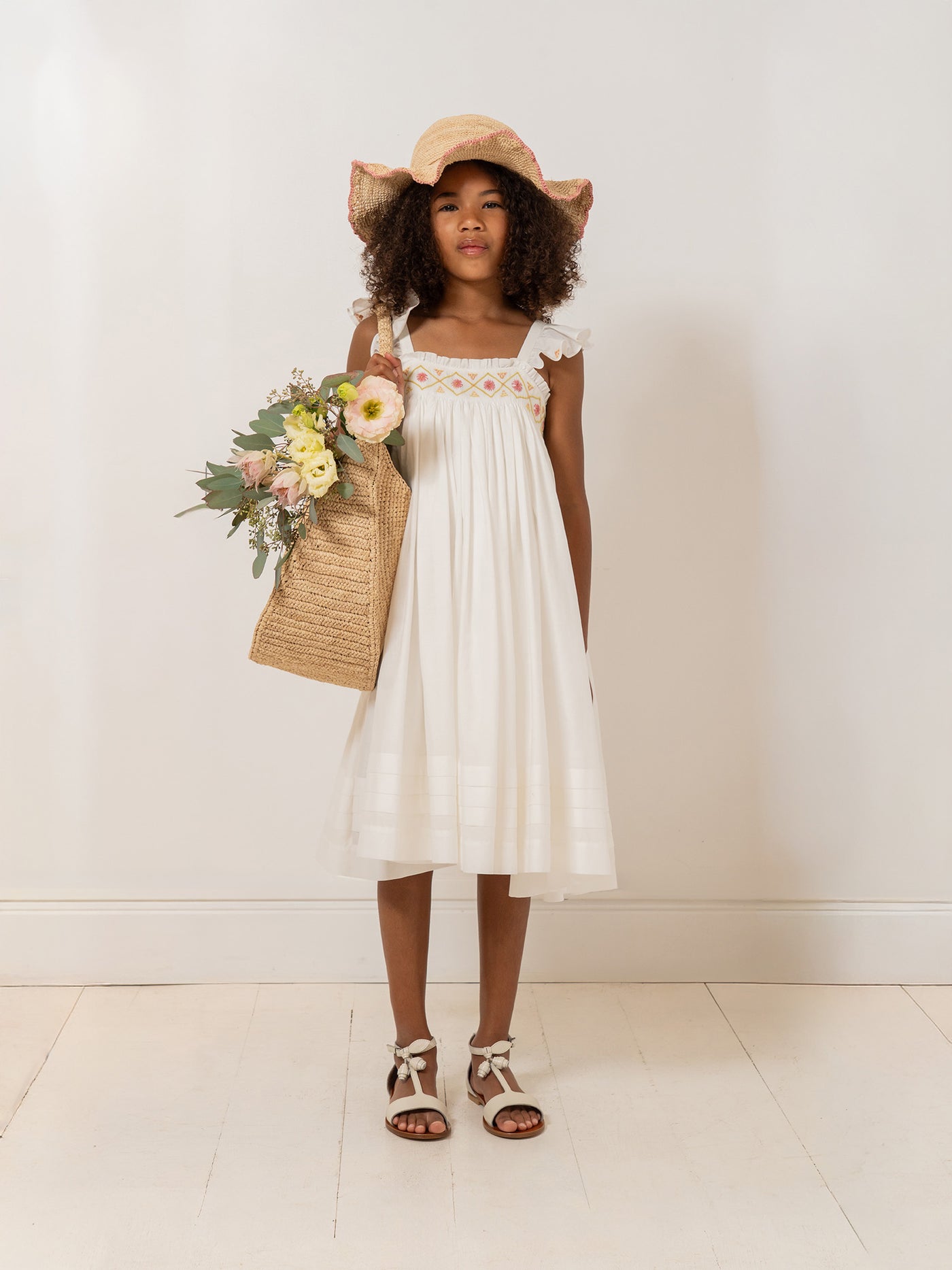 Laora dress smocked and hand-embroidered in organic cotton