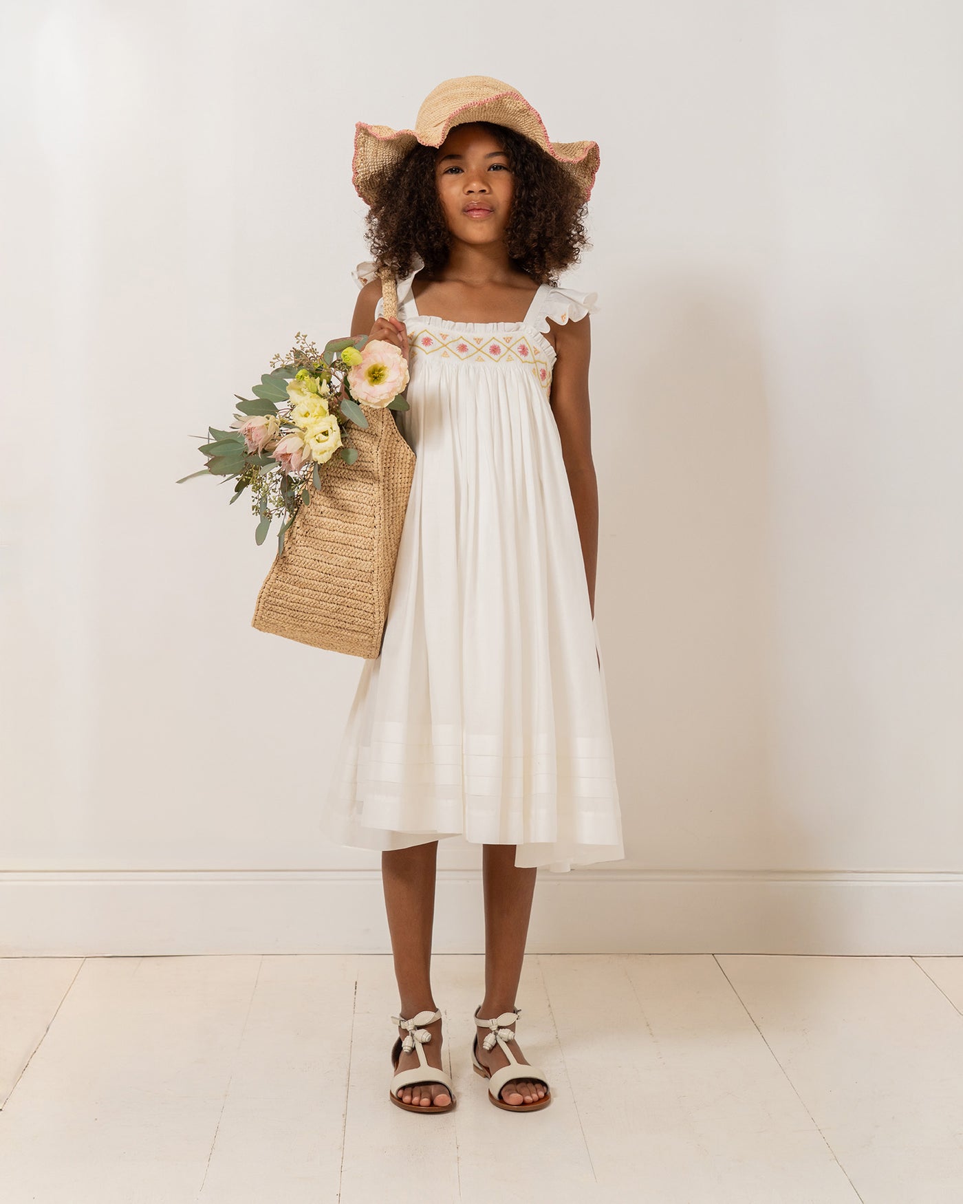 Girl's Look Summer 2026 - Smocked and hand-embroidered dress in organic cotton