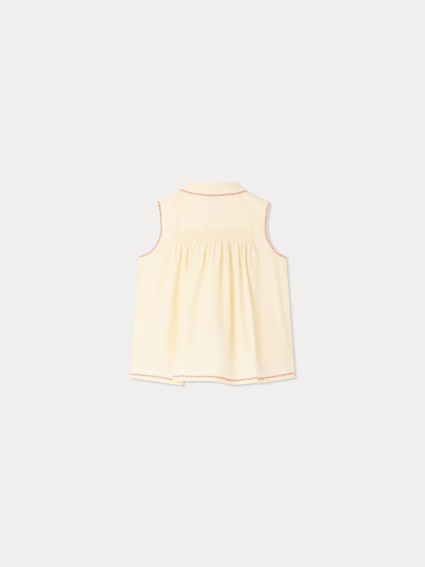 Lexi smocked and hand-embroidered blouse in organic cotton