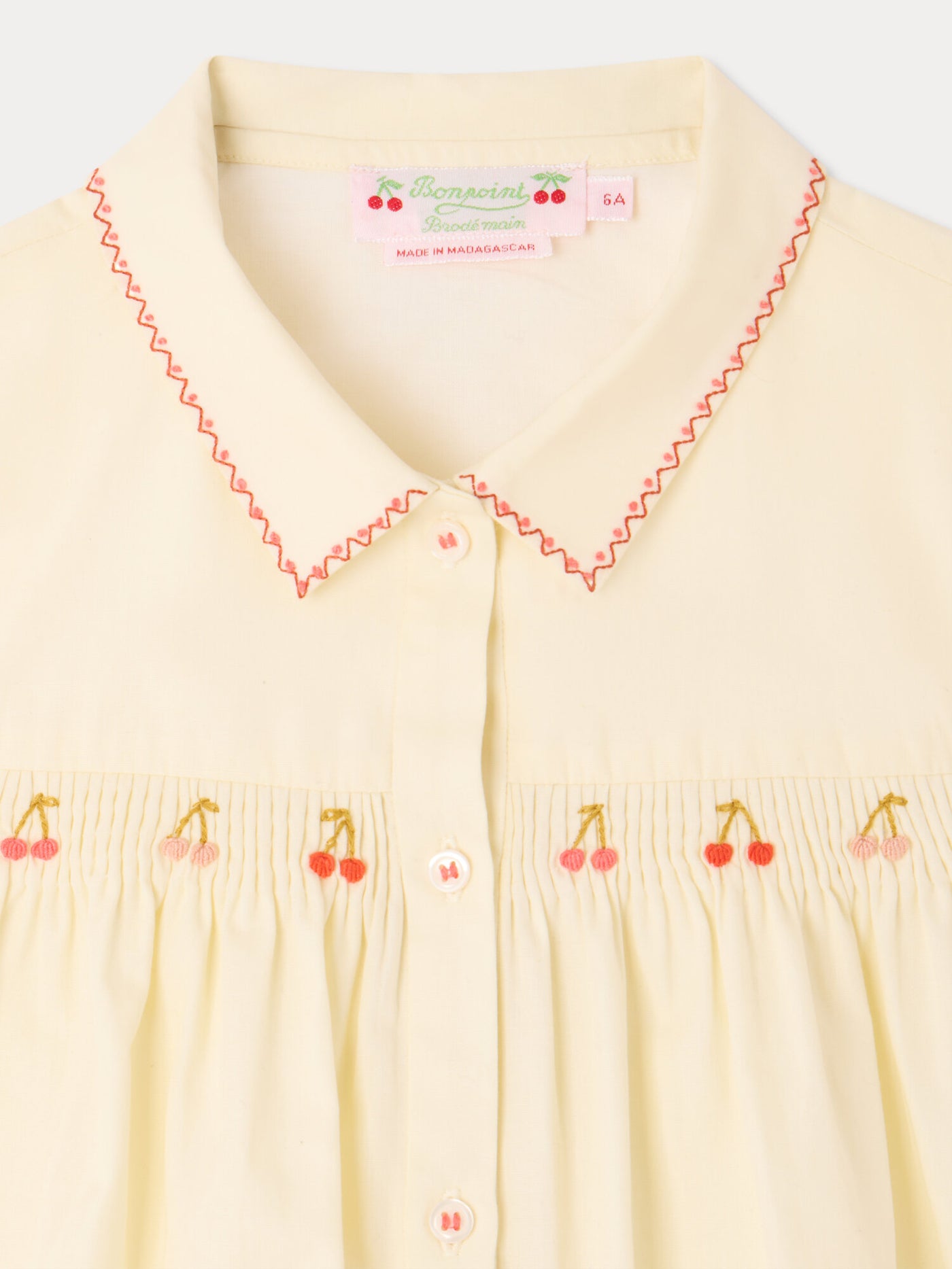 Lexi smocked and hand-embroidered blouse in organic cotton