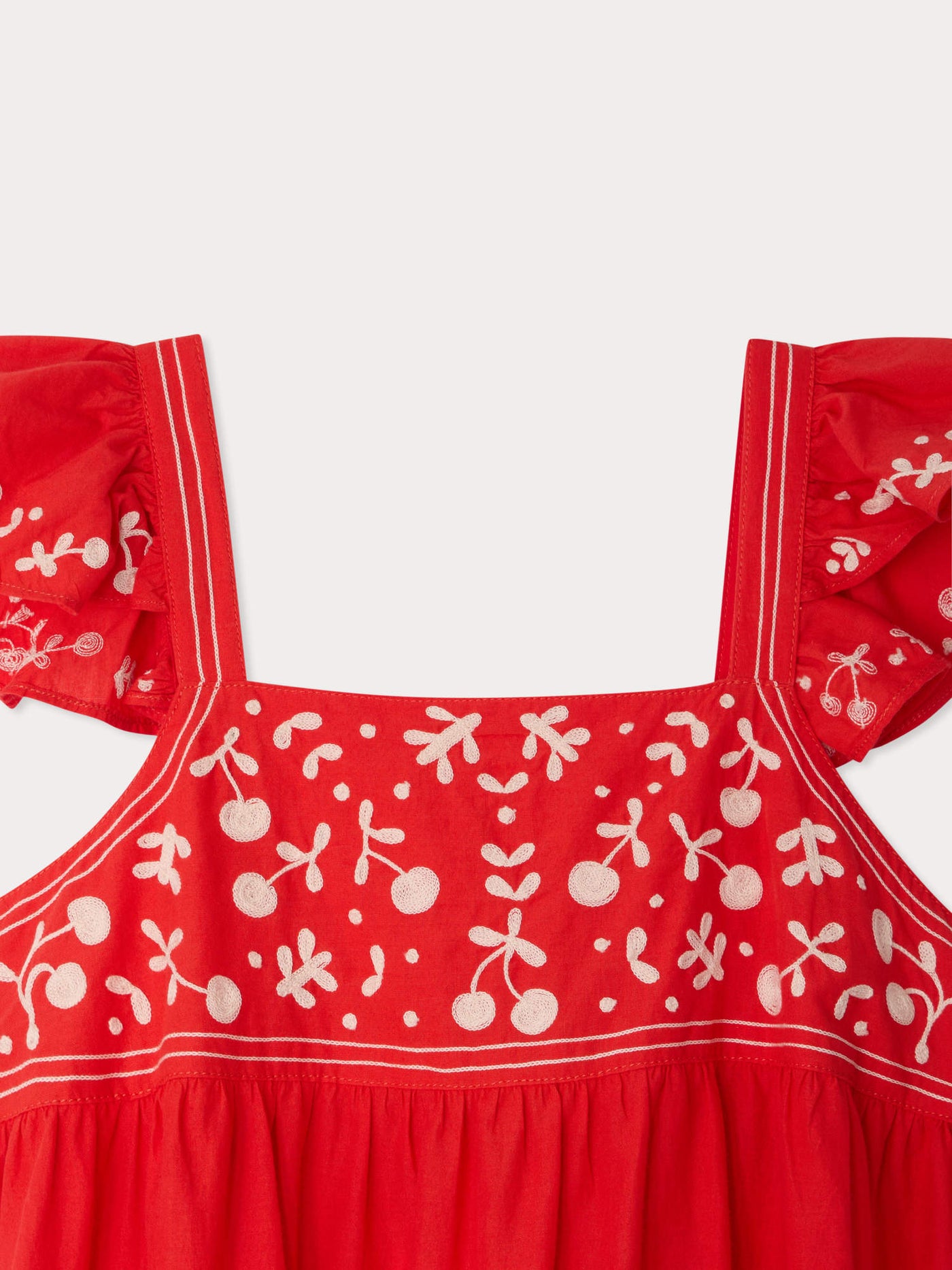 Cora hand-embroidered dress with ruffles in organic cotton