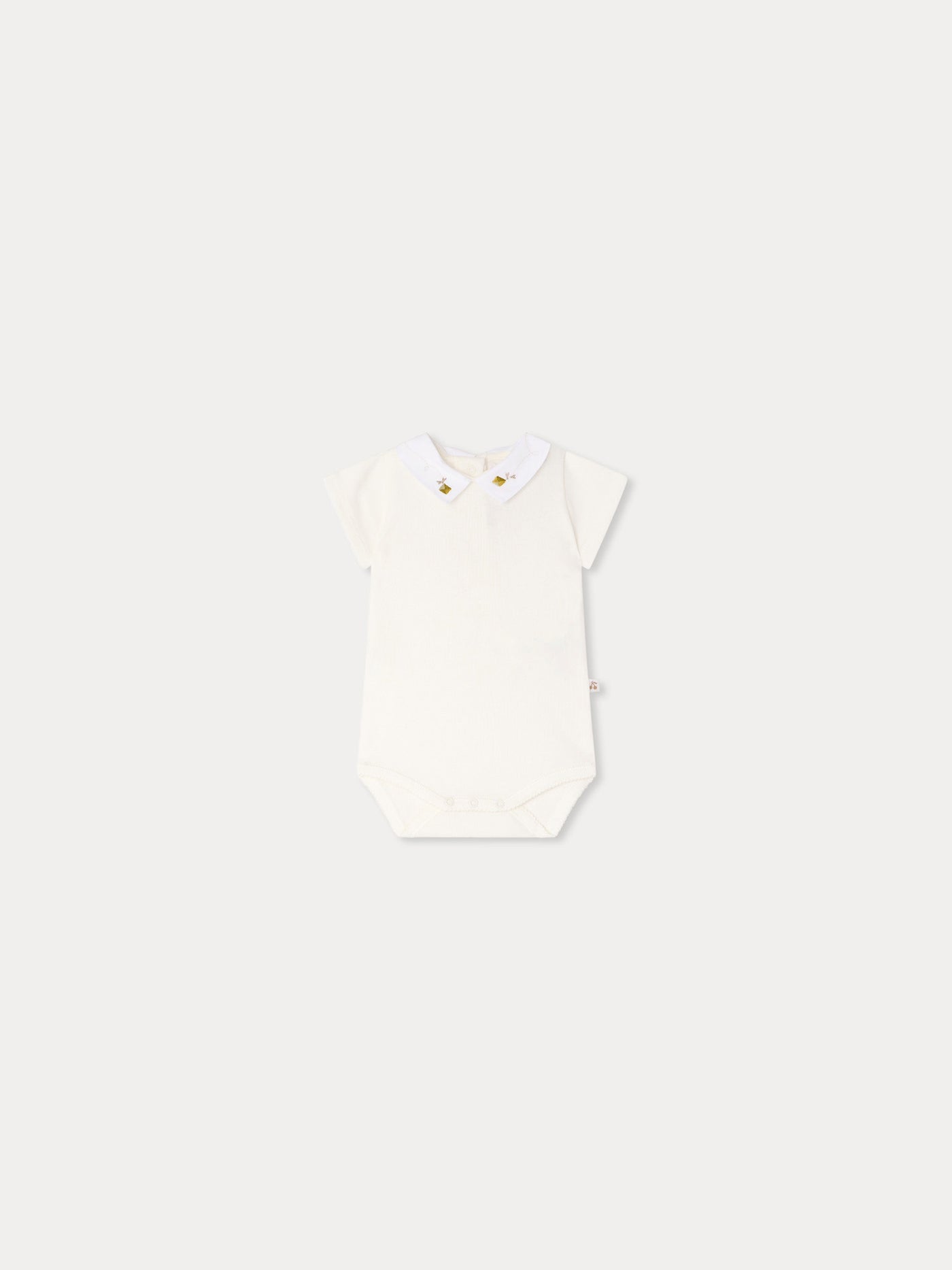 Juillet bodysuit with hand-embroidered kites in organic cotton