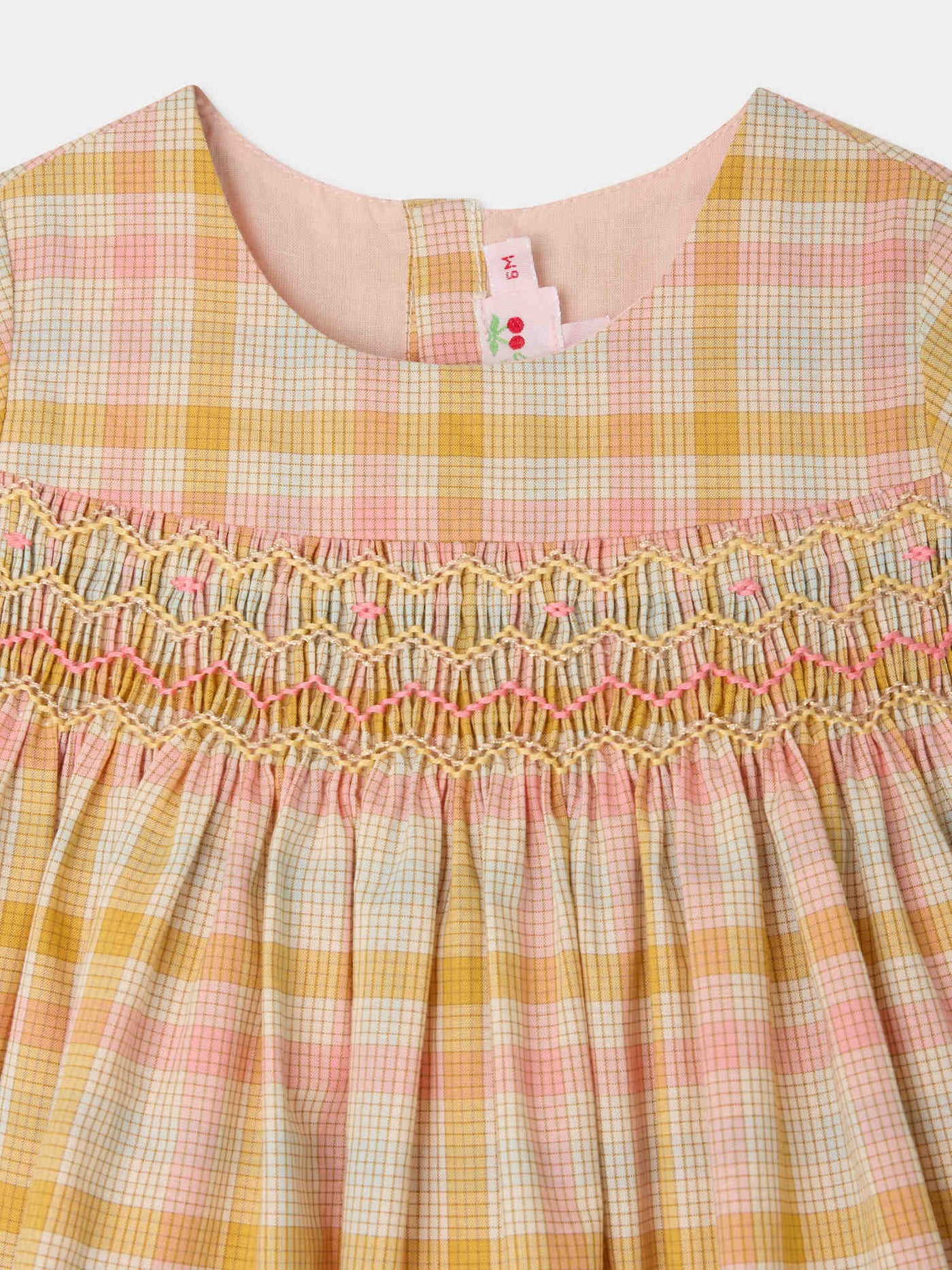 Maruska smocked and hand-embroidered dress in organic cotton