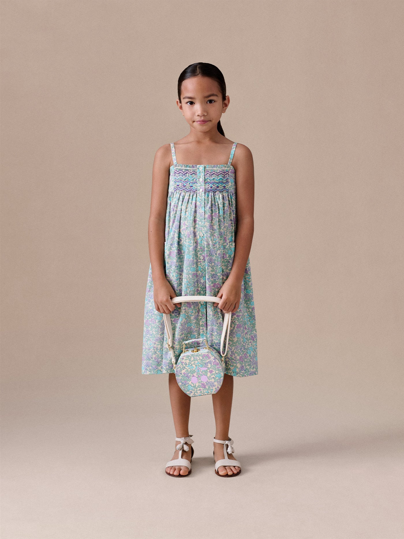 Passion dress smocked and embroidered in Liberty fabric in organic cotton