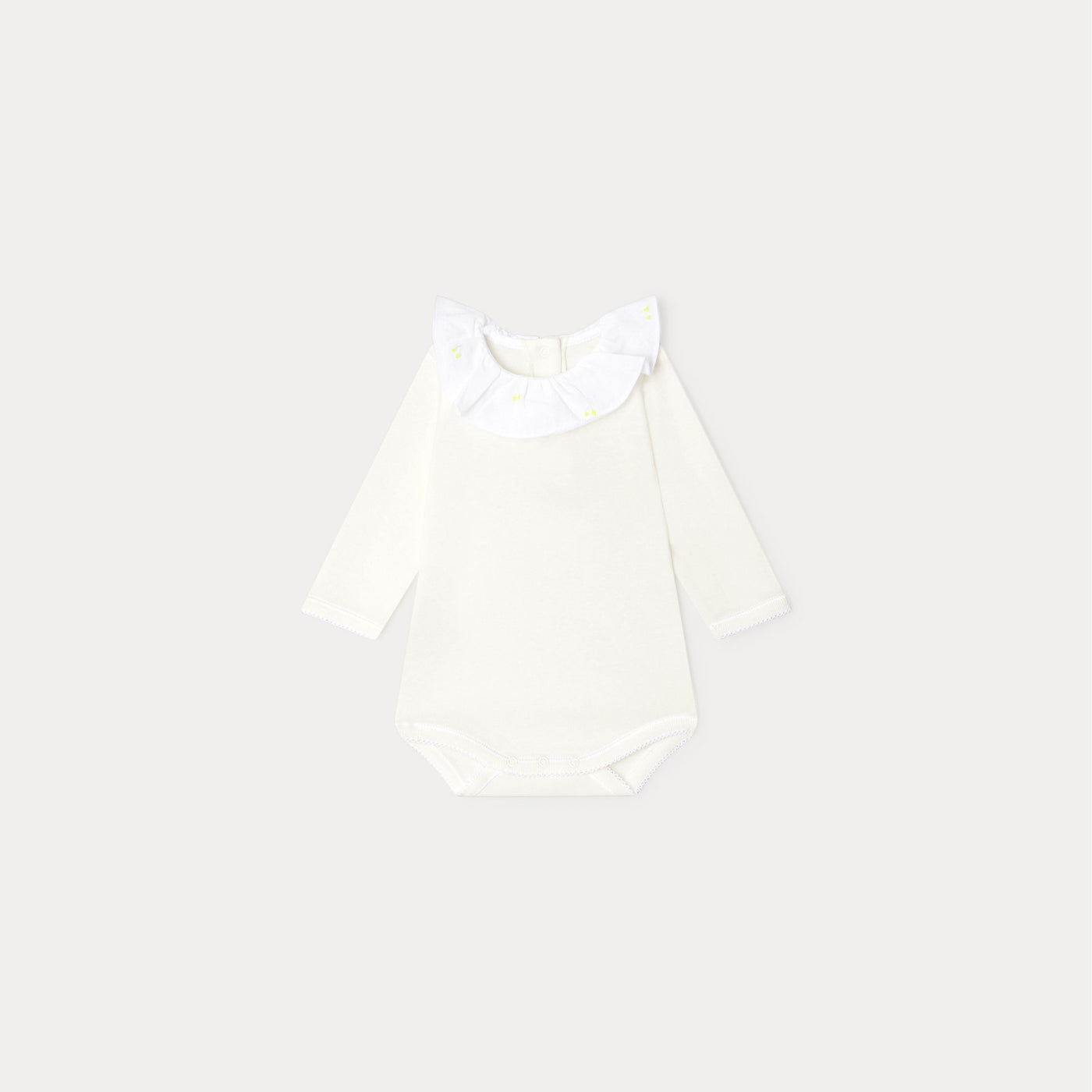 Bonpoint cream newborn onesie with white ruffle collar