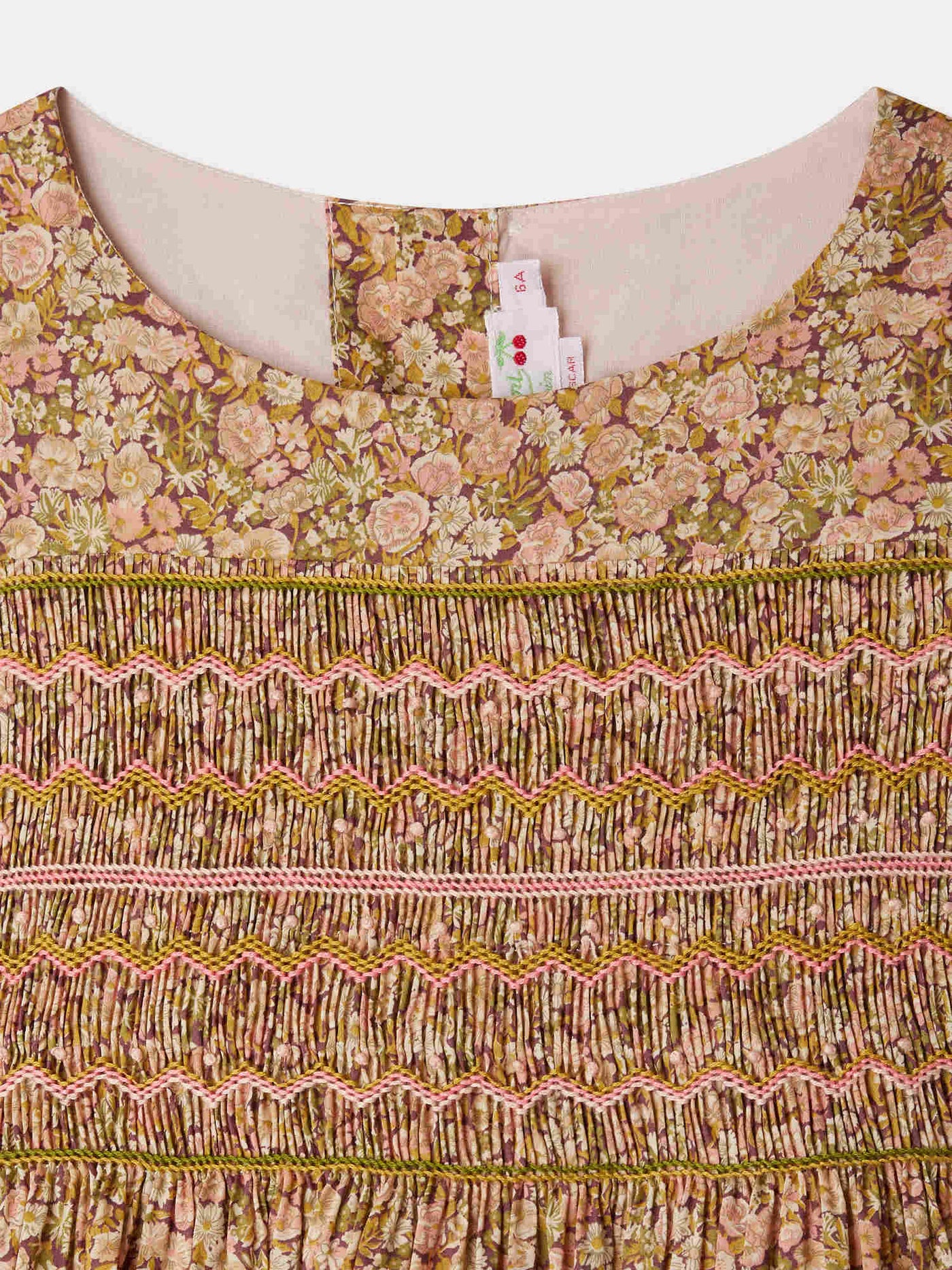 Smocked and embroidered Duchess dress in Liberty fabric in organic cotton