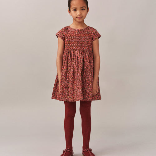 Smocked and embroidered Duchesse dress in Liberty fabric in organic cotton