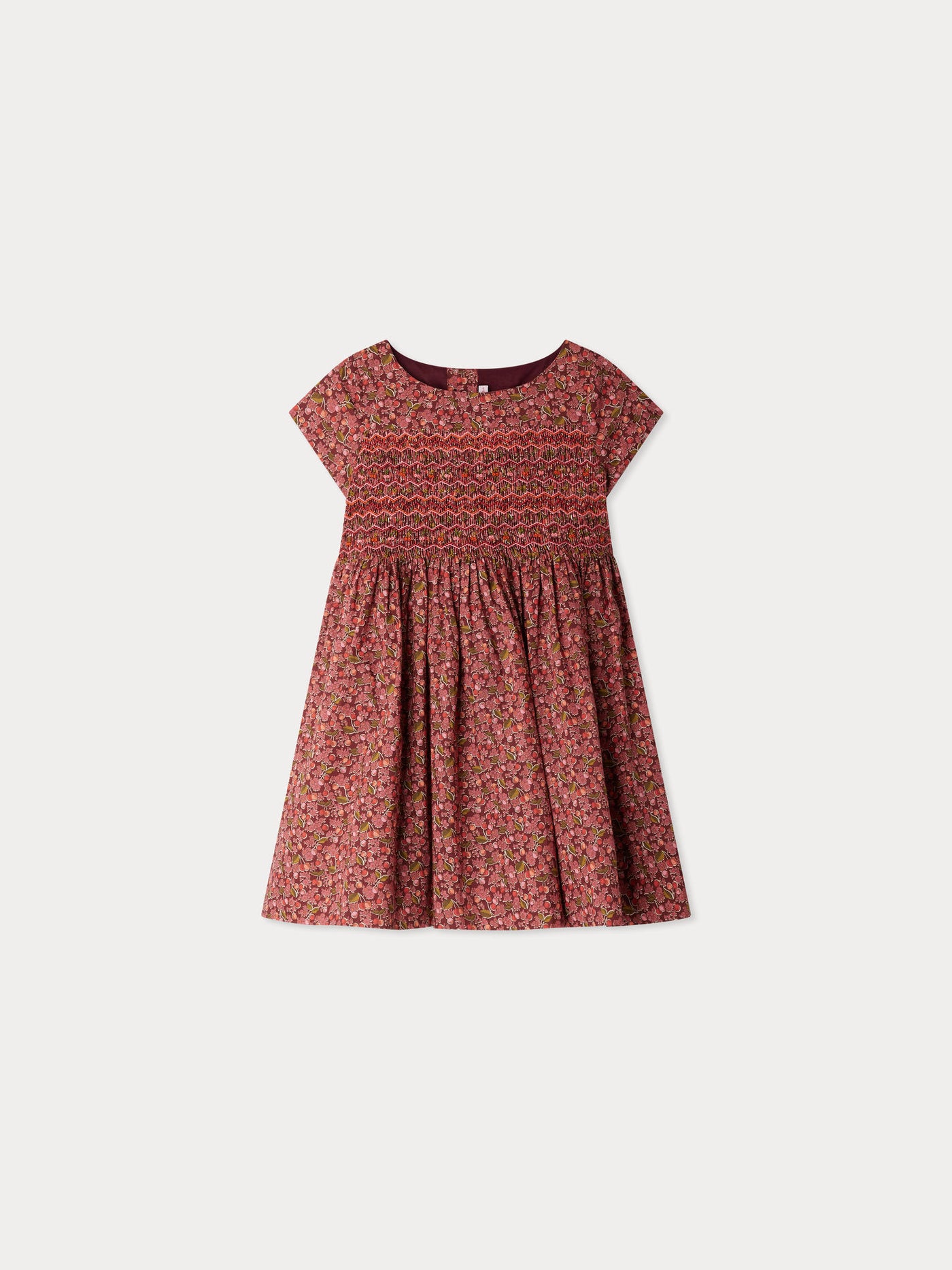 Smocked and embroidered Duchesse dress in Liberty fabric in organic cotton