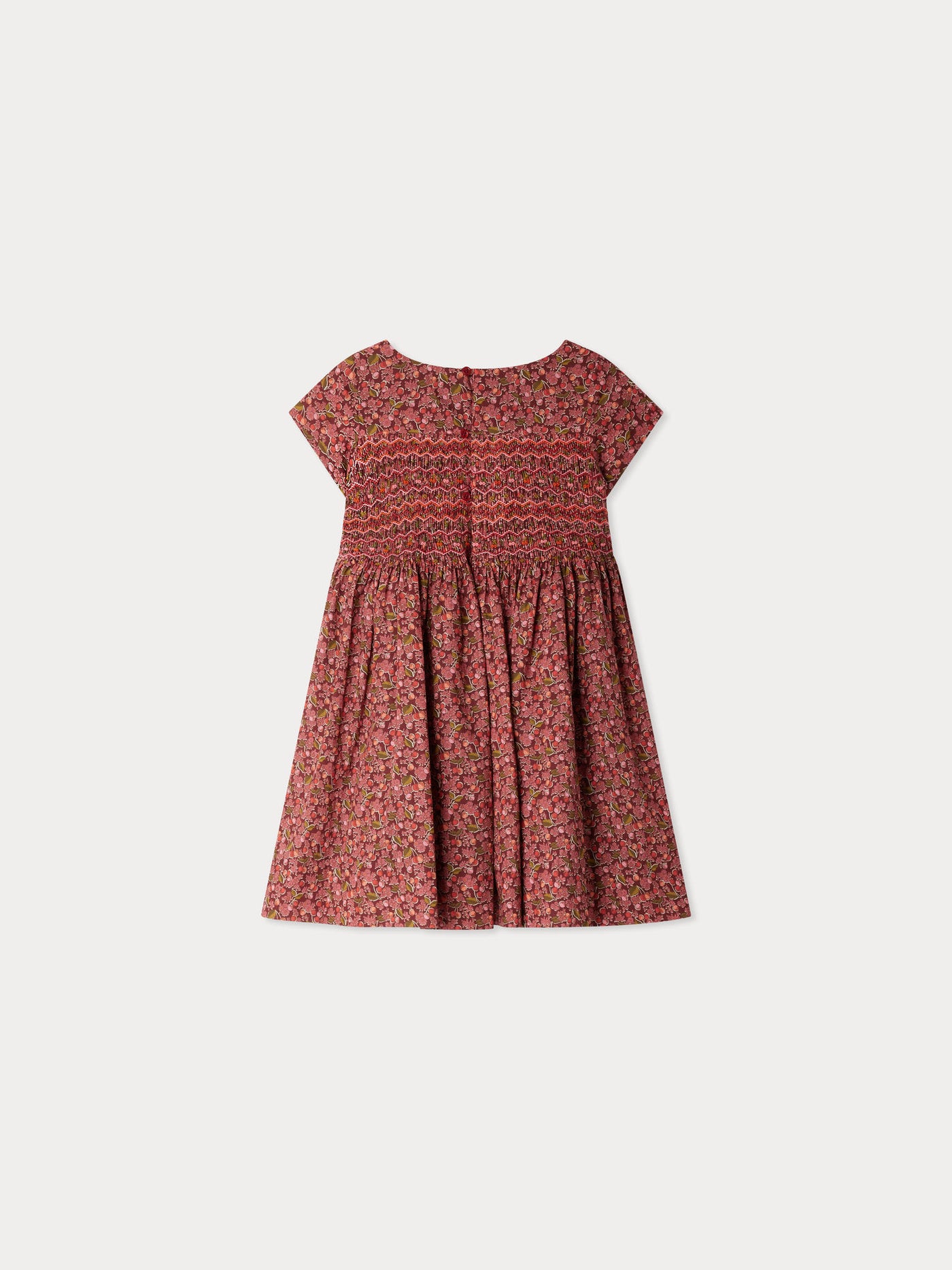 Smocked and embroidered Duchesse dress in Liberty fabric in organic cotton