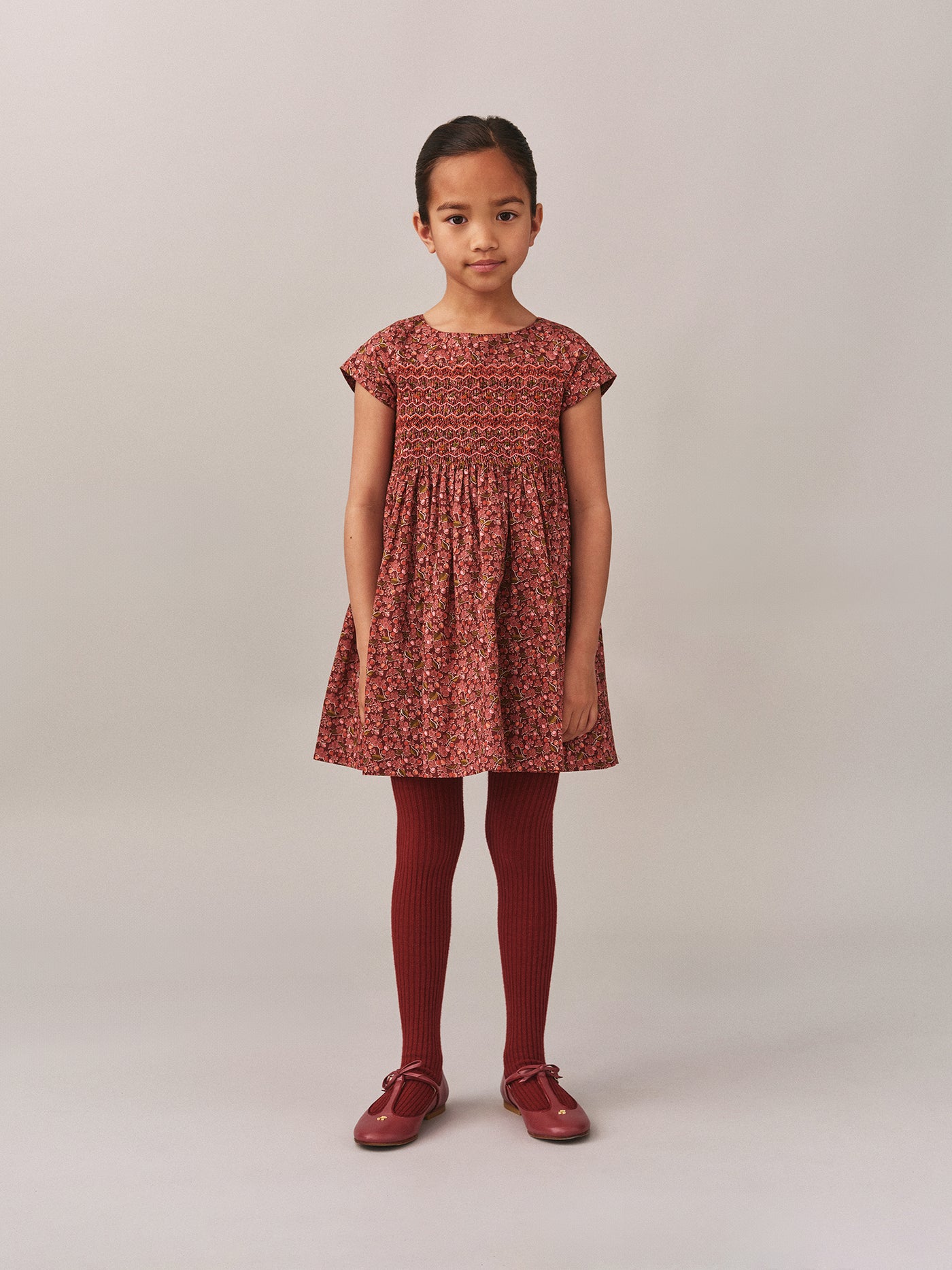 Smocked and embroidered Duchess dress in Liberty fabric in organic cotton