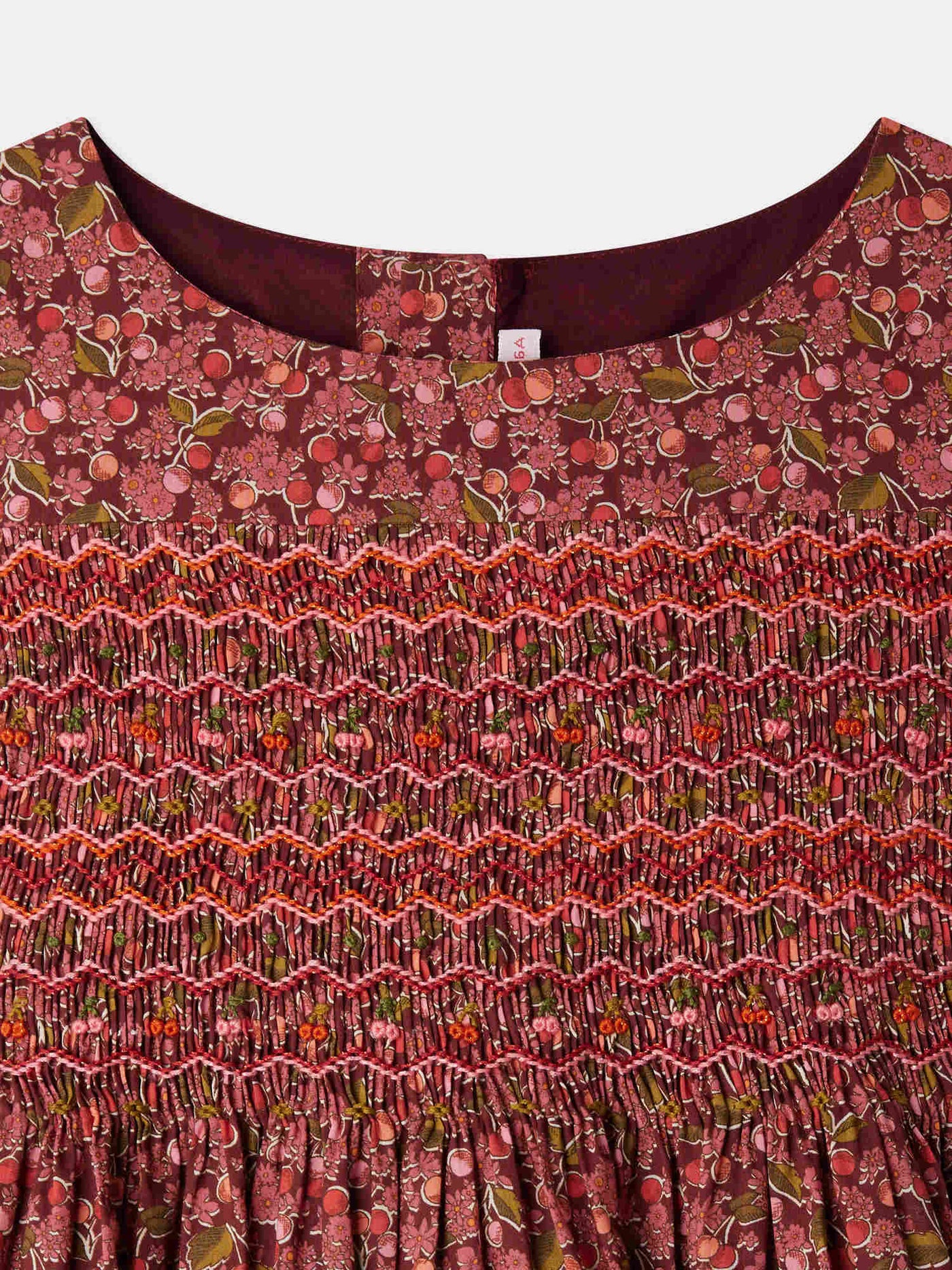 Smocked and embroidered Duchess dress in Liberty fabric in organic cotton