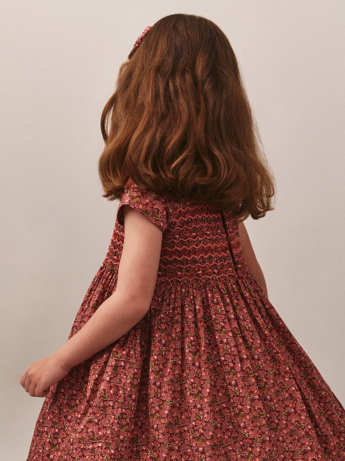 Smocked and embroidered Duchess dress in Liberty fabric in organic cotton