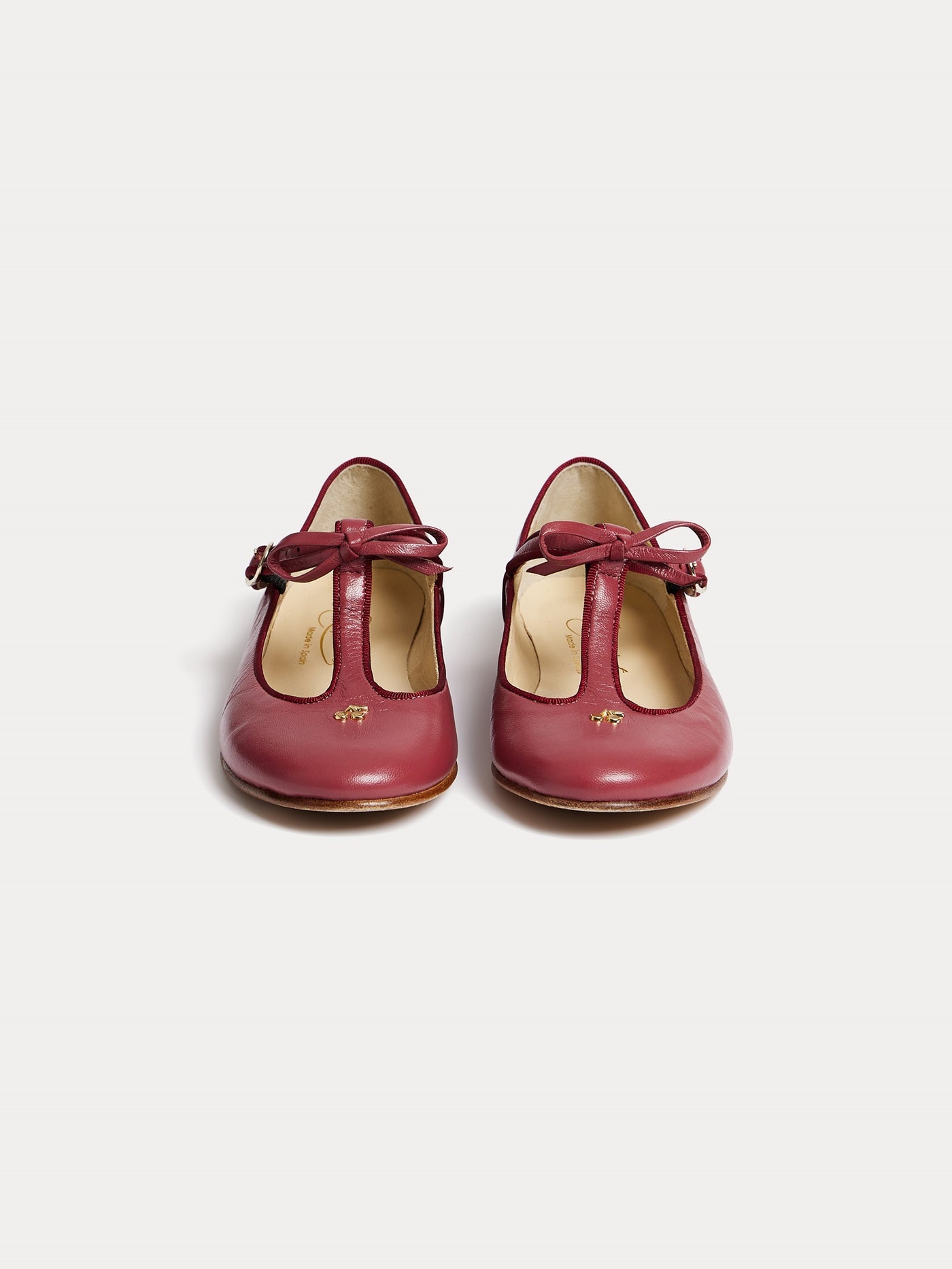 Joyce salomés in burgundy and cherry gold leather