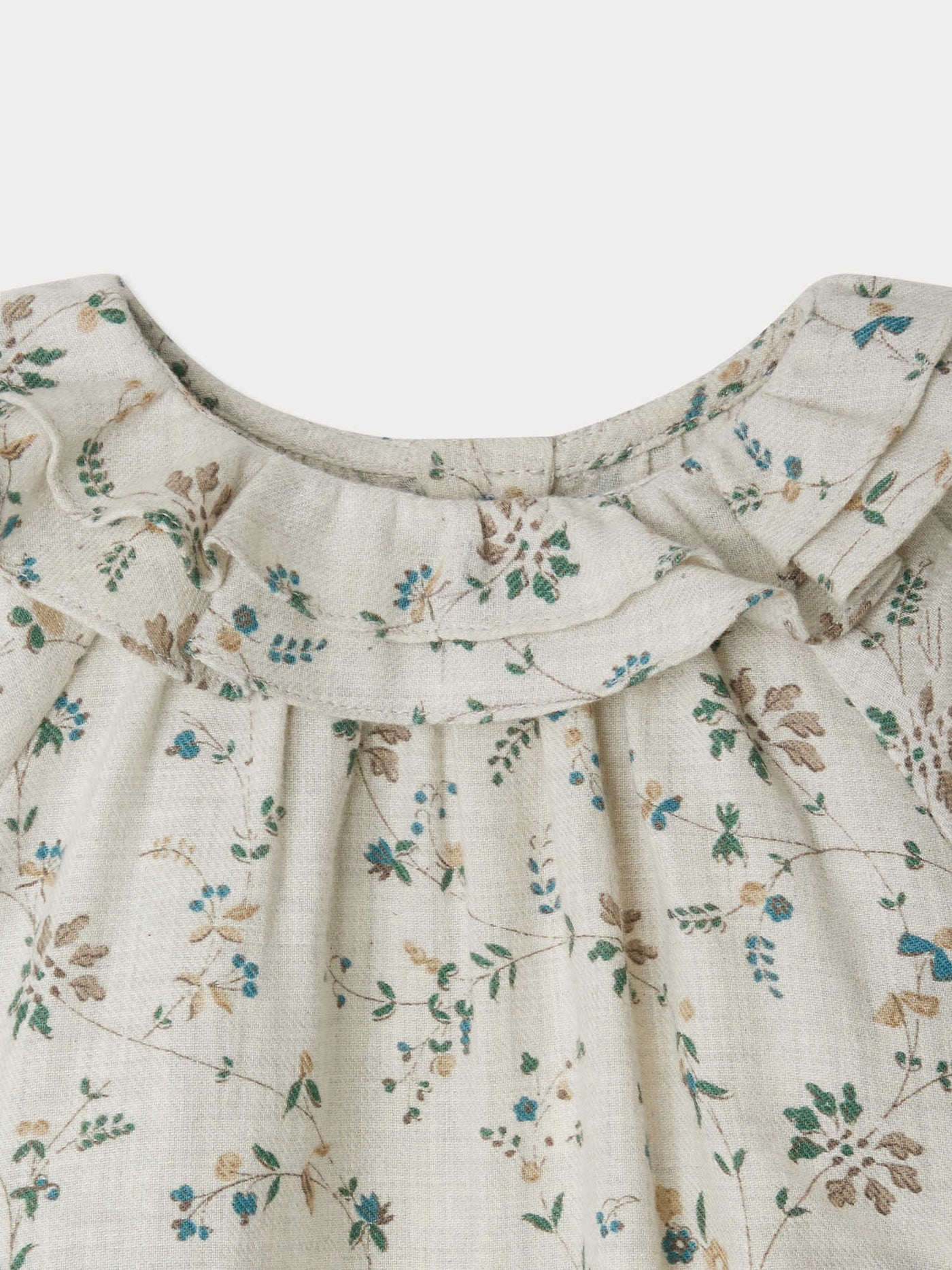 Dolci ruffled round neck blouse