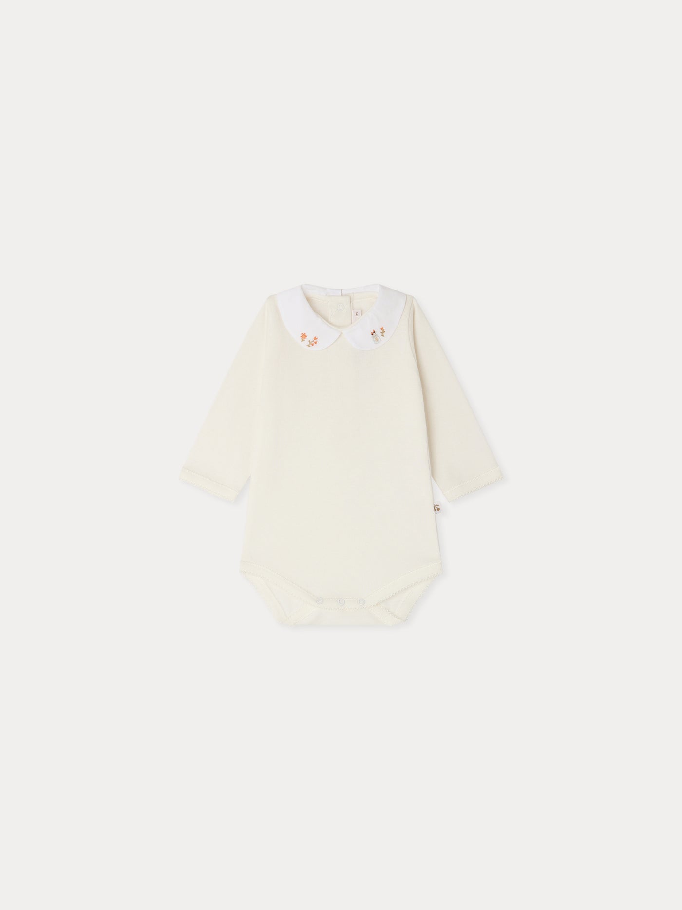 Cygne bodysuit with hand-embroidered collar flowers and brushes in organic cotton