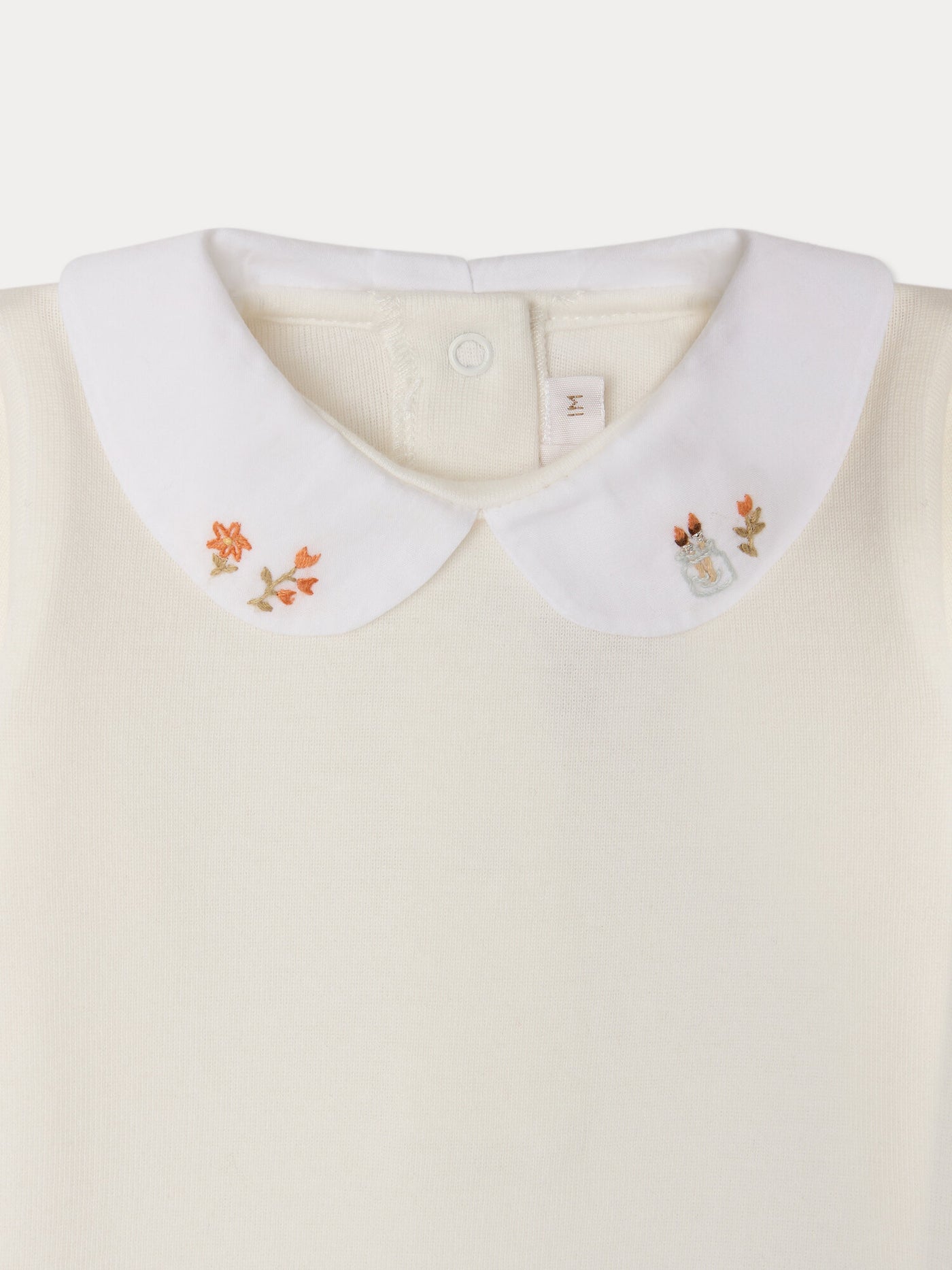 Cygne bodysuit with hand-embroidered collar flowers and brushes in organic cotton