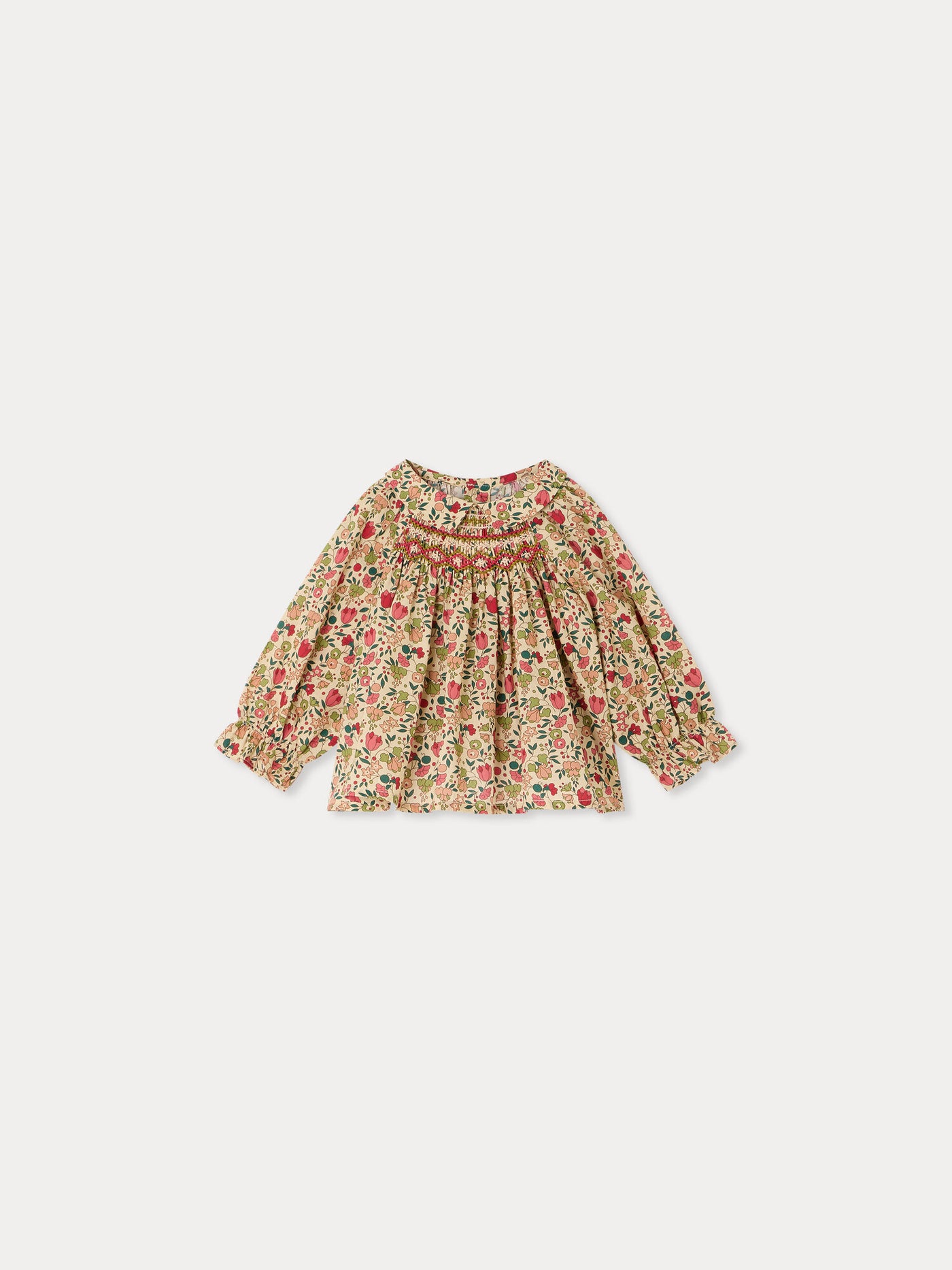 Pompom baby blouse in Liberty fabric smocked and hand-embroidered organic cotton